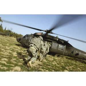  US Army Soldiers Prepare to Board a UH 60 Black Hawk 