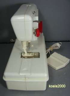 SINGER LOCKSTITCH TOY SEWING MACHINE WITH RED CASE  