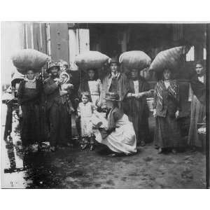  Immigrants,pier,Red Cross woman,c1910,small girl