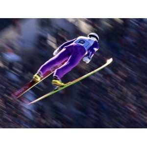  Blurred Action of Ski Jumper Flying Throught the Air 