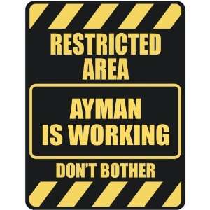   RESTRICTED AREA AYMAN IS WORKING  PARKING SIGN