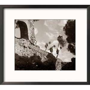  High Adventure Children Climbing Amongst the Ruins of a Castle 