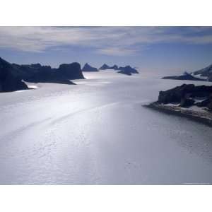  Windswept, Bare Ice Glacier Flows Down From Vast Polar 