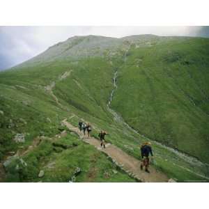  A Team of Hikers Climb Scotlands Ben Nevis Peak Stretched 