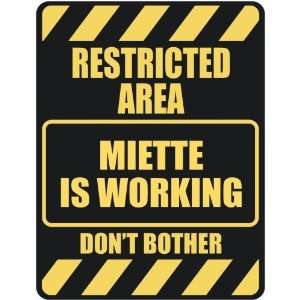   RESTRICTED AREA MIETTE IS WORKING  PARKING SIGN