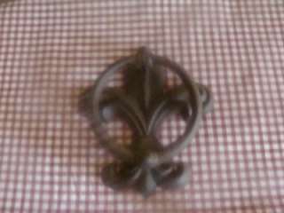 This is a gorgeous door knocker. It is rustic brown in color and has 