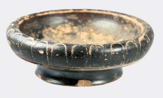 Greek black glazed and moulded pottery dish  