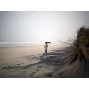  Beachgoer Walks Along an Eroded Section of Robert Moses 