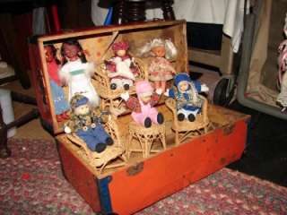 VINTAGE RED WOODEN TRUNK WITH SEVEN DOLLS SET OF WICKER FURNITURE 